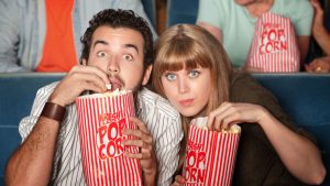 Gripped audience eating popcorn